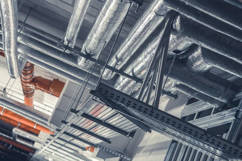Building services and cable trays under a ceiling