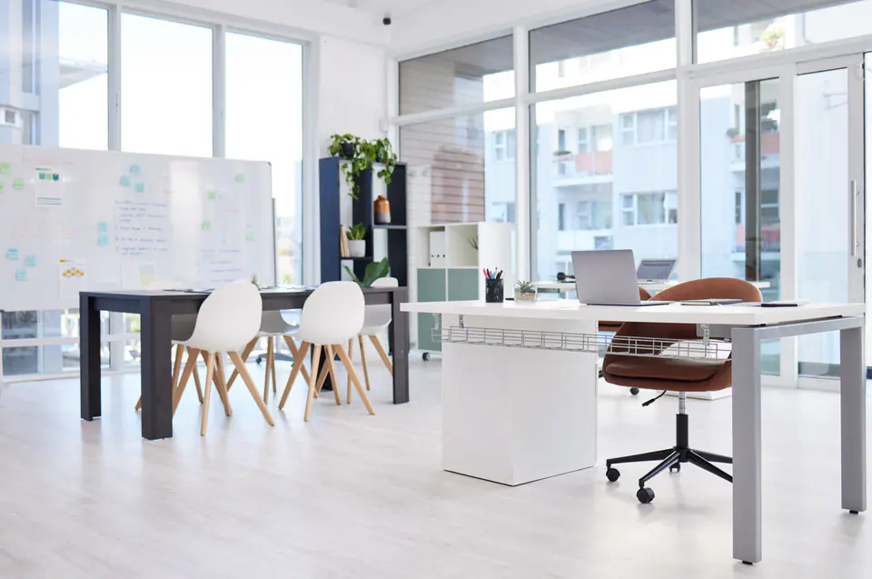 A bright modern office with desks